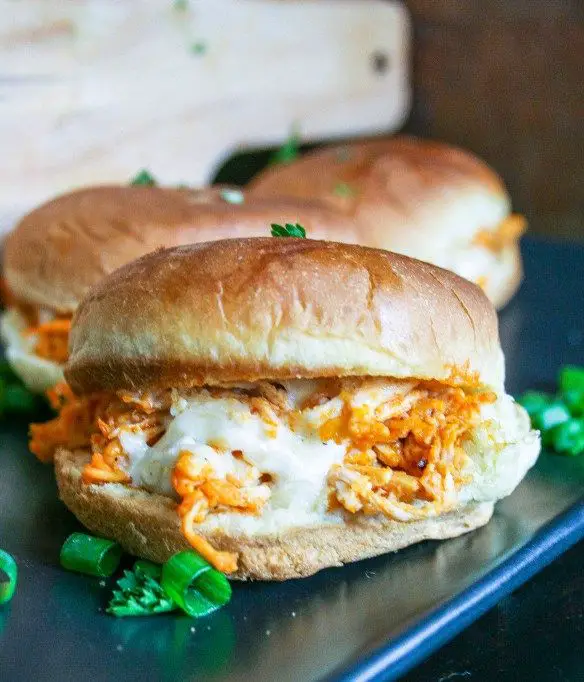 buffalo chicken sliders are made with shredded chicken, wing sauce ...