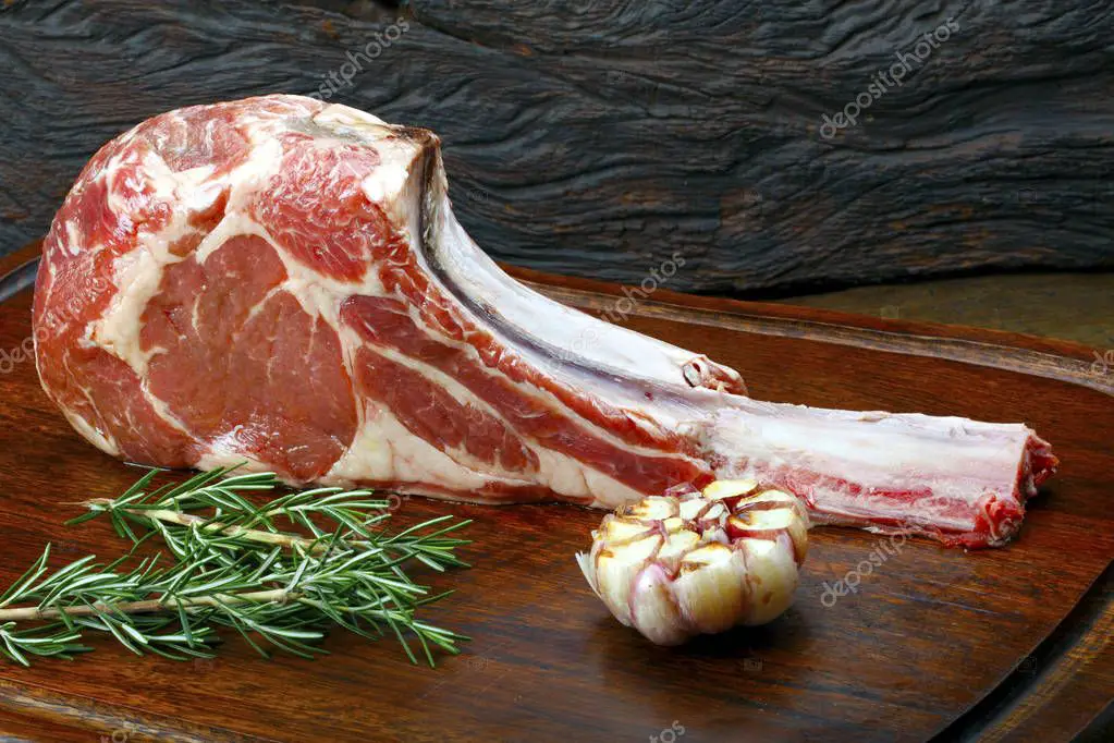 Raw Tomahawk Steak Garlic Herbs Wooden Board  Stock Photo ...